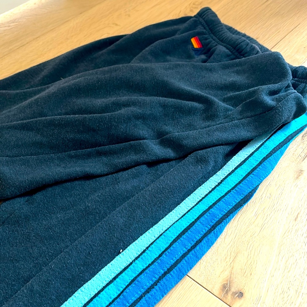 AVIATOR NATION SWEATS, BLACK WITH BLUE STRIPES DOWN ONE LEG, SIZE ADILT XS